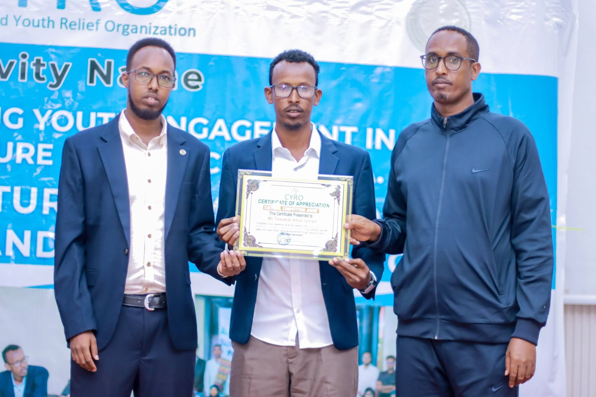 A judge receiving a certificate of appreciation